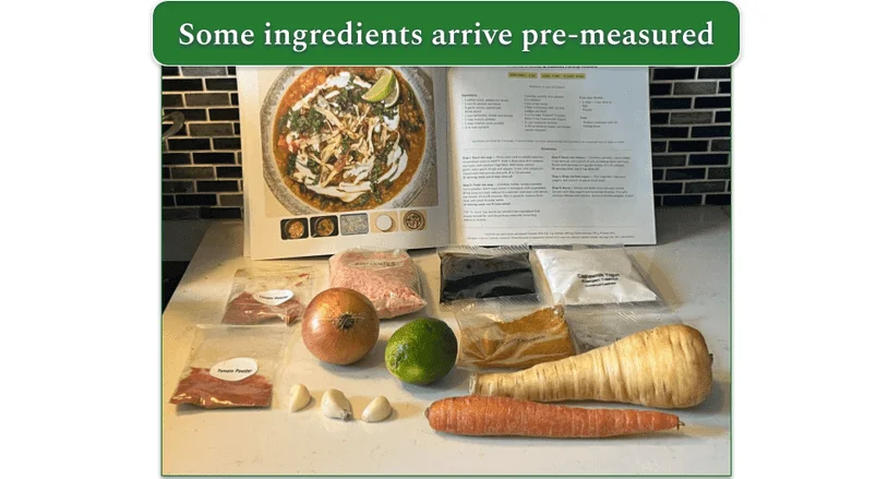 A wooden chopping board with whole vegetables and ingredients individually packed