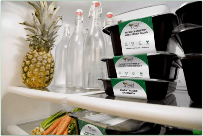 Image of Seattle Sutton meals, labeled clearly, and stacked in the fridge