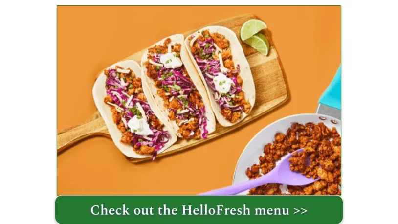 Three Tacos on a Cutting Board