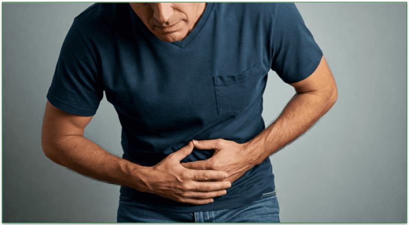 A man holding his abdominal region because of illness.